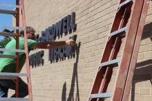 Workers recently placed new sign letters on the Gladewater library building.